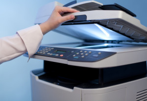 Woman's hand with copier