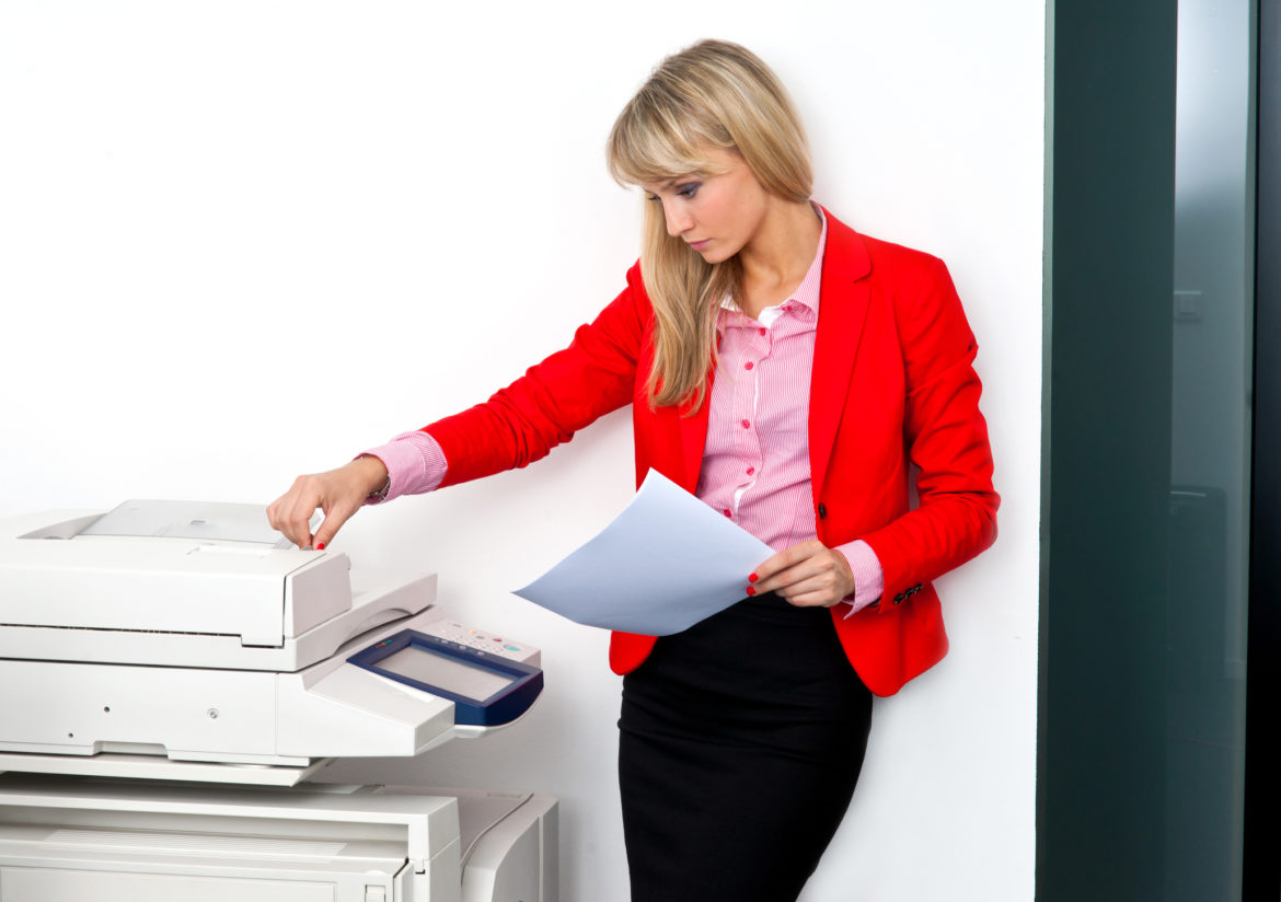 woman learning how to use office automation equipment